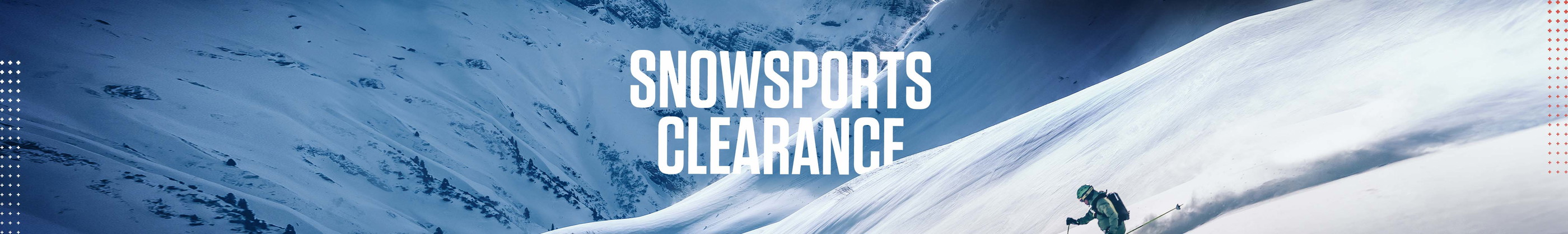 Snowsport clearance. A person on a snowy slope skiing down, wearing full ski gear