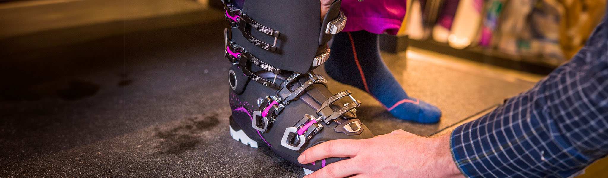 An image of a person having their ski boots fit