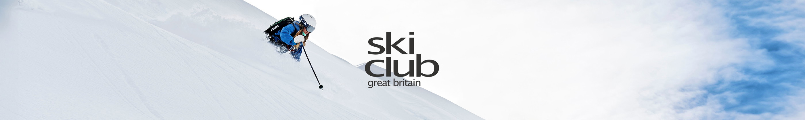 A person is skiing away from the camera