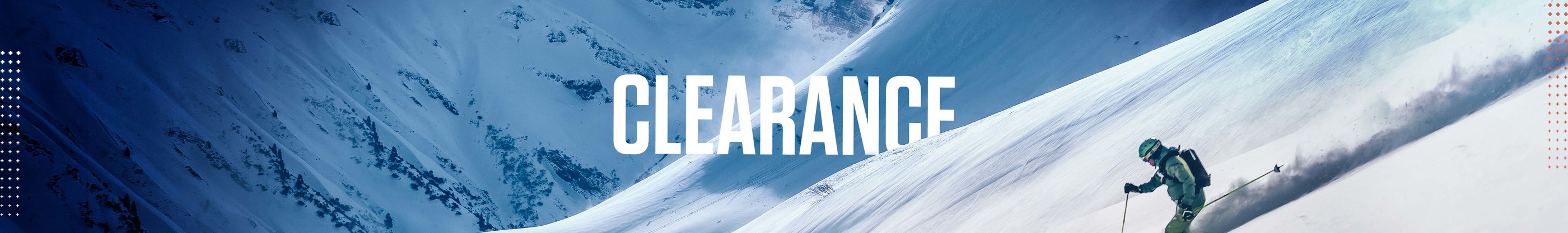 Snowsport clearance. A person on a snowy slope skiing down, wearing full ski gear