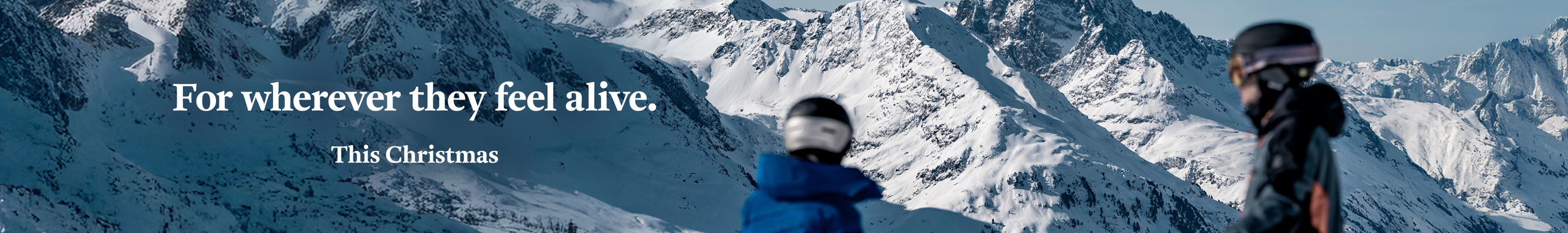 Shop Snow and Rock Christmas. Two people in ski gear. 