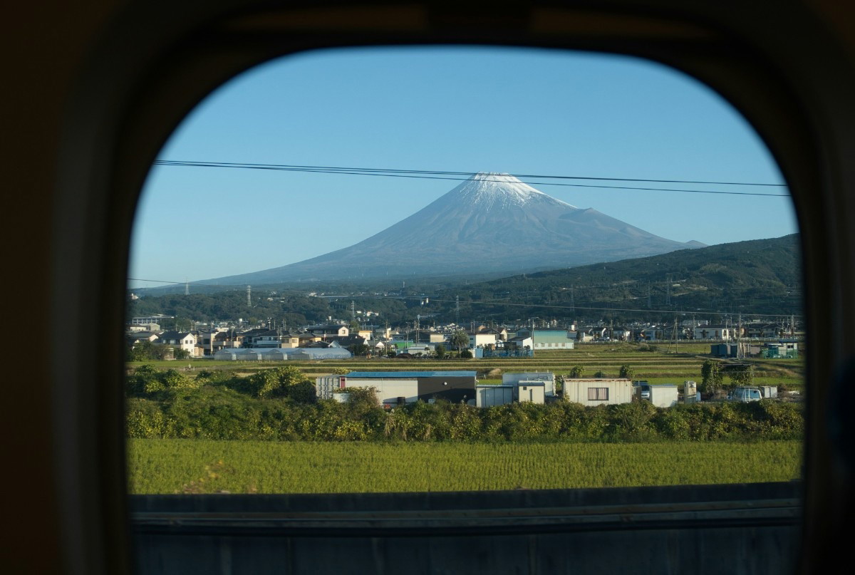 An image of Mt Fuji taken from a train window 